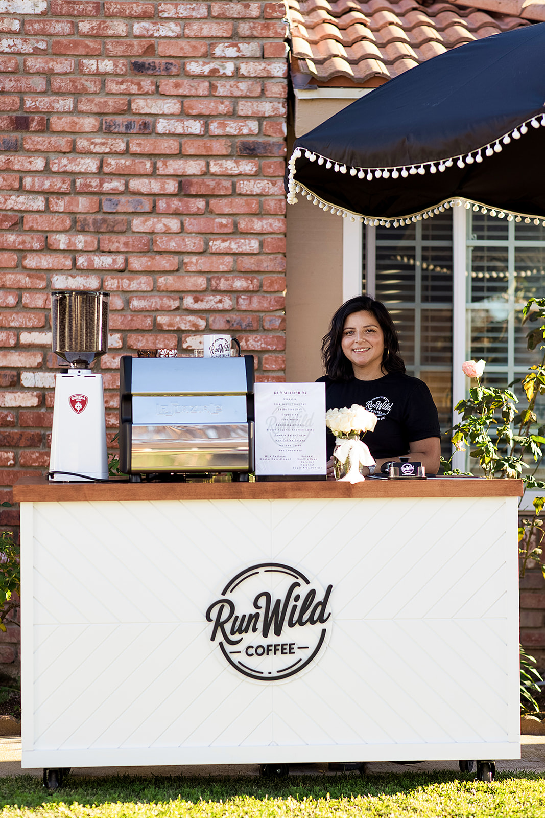 Run Wild Coffee owner at the cart ready to serve